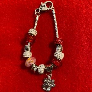 Red and white charm bracelet.